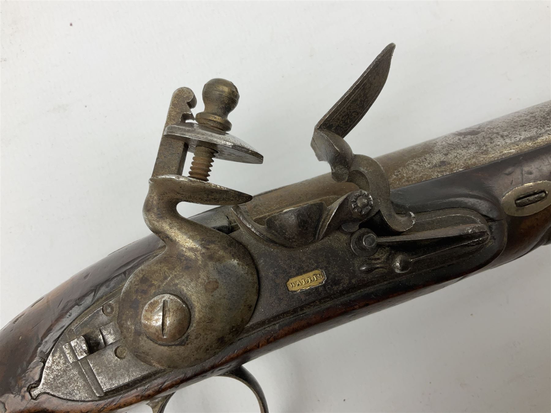 Early 19th century flintlock pistol by George Wallis Hull, the 16cm barrel with ram rod under, chequered walnut stock with sunburst engraved German silver butt cap and horn fore-ends, engraved steel furniture with pineapple finial, gold poincon for Hull to top of barrel and for Wallis to lock plate 30cm overall
