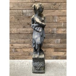 Cast stone weathered garden statue of Venus on pedestal