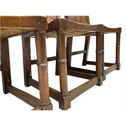 'Gnomeman' set of three oak dining chairs, panelled backs over curved seat rails with drop in rope rush seats, turned front supports with collar joined by plain stretchers, two with carved seated gnome figures, painted

Provenance - This collection of early 'Gnomeman' furniture comes to us directly from the Whittaker family. The pieces were made by the vendor's father Thomas Whittaker in the 1930/40s for his own use. During this time, he lived in York and made items for himself and friends. Whittaker adopted the gnome as a signature and trademark after his move to Littlebeck, Whitby.