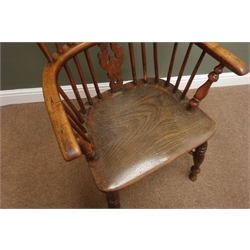  Early 19th century ash and elm high back Windsor armchair, shaped pierced splat and stick back, turned supports joined by crinoline stretcher, seat stamped 'J. Spencer'  