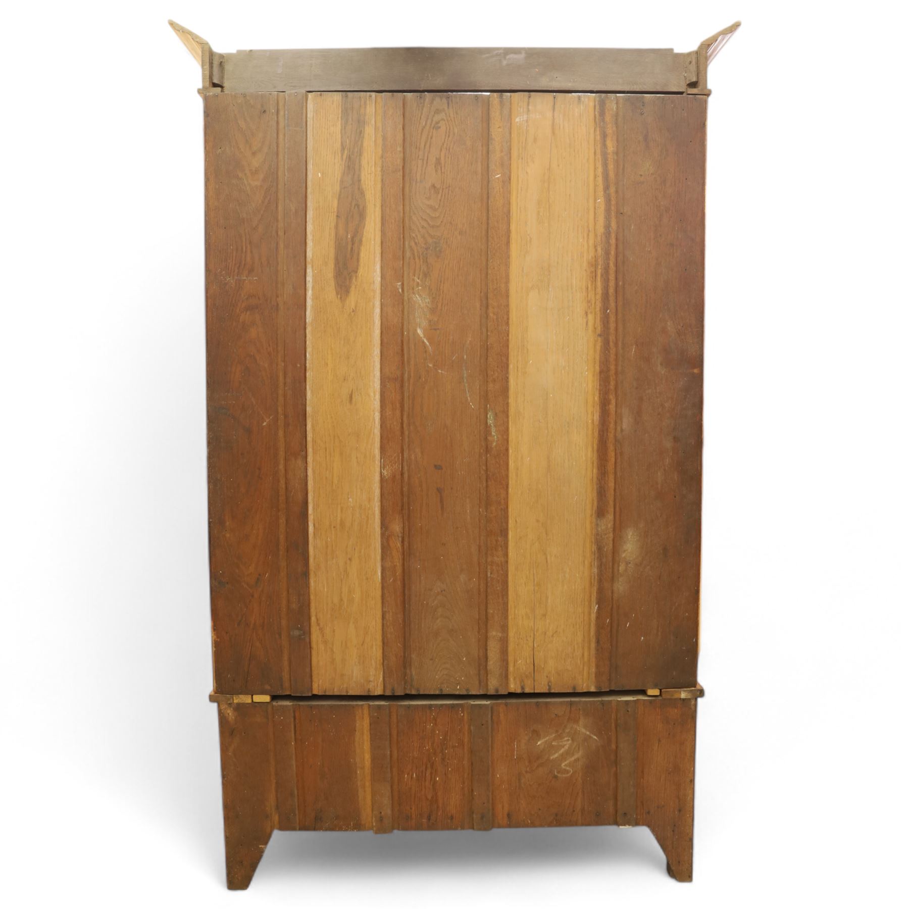 Art Nouveau oak wardrobe, central mirrored door flanked by panels inlaid with stylised tulip motifs, fitted with hanging rail and hooks, single drawer to base with brass handles