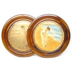  Pair early 20th century circular walnut frames, colour prints after William Henry Margetson, 'The Sea Hath its Pearls' and 'Flowers of the Field', D68cm overall  