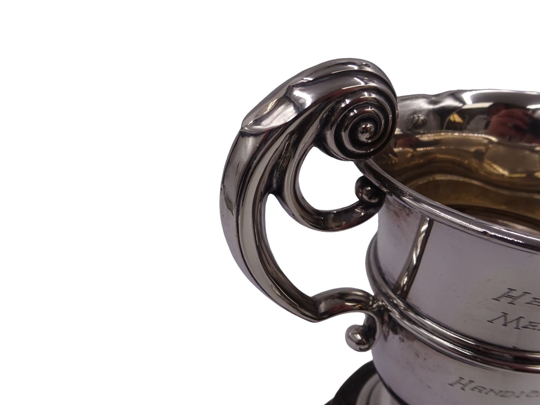1920s silver trophy cup, with twin scroll handles and girdle, upon circular stepped foot,  the body with presentation engraving 'The Helen Andrews Memorial Cup, Handicraft Section', hallmarked Walker & Hall 1927, fixed upon ebonised wooden base with applied winners plaques, including base H18cm