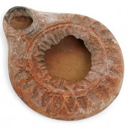 A group of five ancient terracotta oil lamps - Near East and Eastern Mediterranean (c.3rd millennium BC-9th century AD) comprising: Levantine open bowl-type lamp (c.3rd-2nd millennium BC) hand-formed with pinched spout and rounded profile; Near Eastern pinched-spout lamp (c.1200 BC) of coarse red clay with wide central fill hole; Roman oil lamp (c.1st-2nd century AD) with flared spout and a rosette-stamped base; Roman circular oil lamp (c.2nd-3rd century AD) with deeply moulded floral decoration in high relief around the fill hole; and a larger Early Islamic (Arab) lamp (c.7th-9th century AD) decorated with incised geometric motifs to the upper surface
Provenance: By the vendor’s repute, acquired/collected in the Middle East (Dead Sea area/Syria) in the 1960s