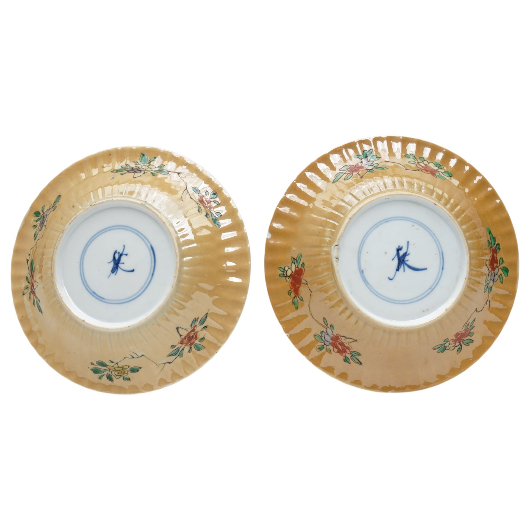 Two Chinese Kangxi period famille verte cafe au lait saucers, decorated with native animals among foliage, with indistinct mark within double rings beneath, D14cm 