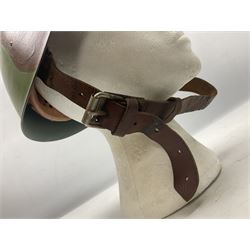 1960s Italian parachutist helmet with liner; camouflage paintwork with parachutist crest to the front