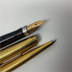Conway Stewart fountain pen with a 14 ct gold nib, together with a Parker fountain pen and ballpoint pen gilt metal set, together with two other pens 