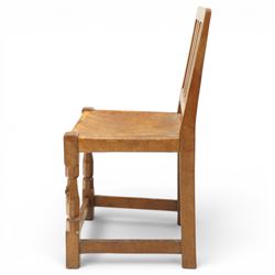 Mouseman - 1940s oak side chair, the slat-back over a slung leather seat, raised on octagonal front supports united by box stretcher, carved with slim mouse signature, by the workshop of Robert Thompson of Kilburn