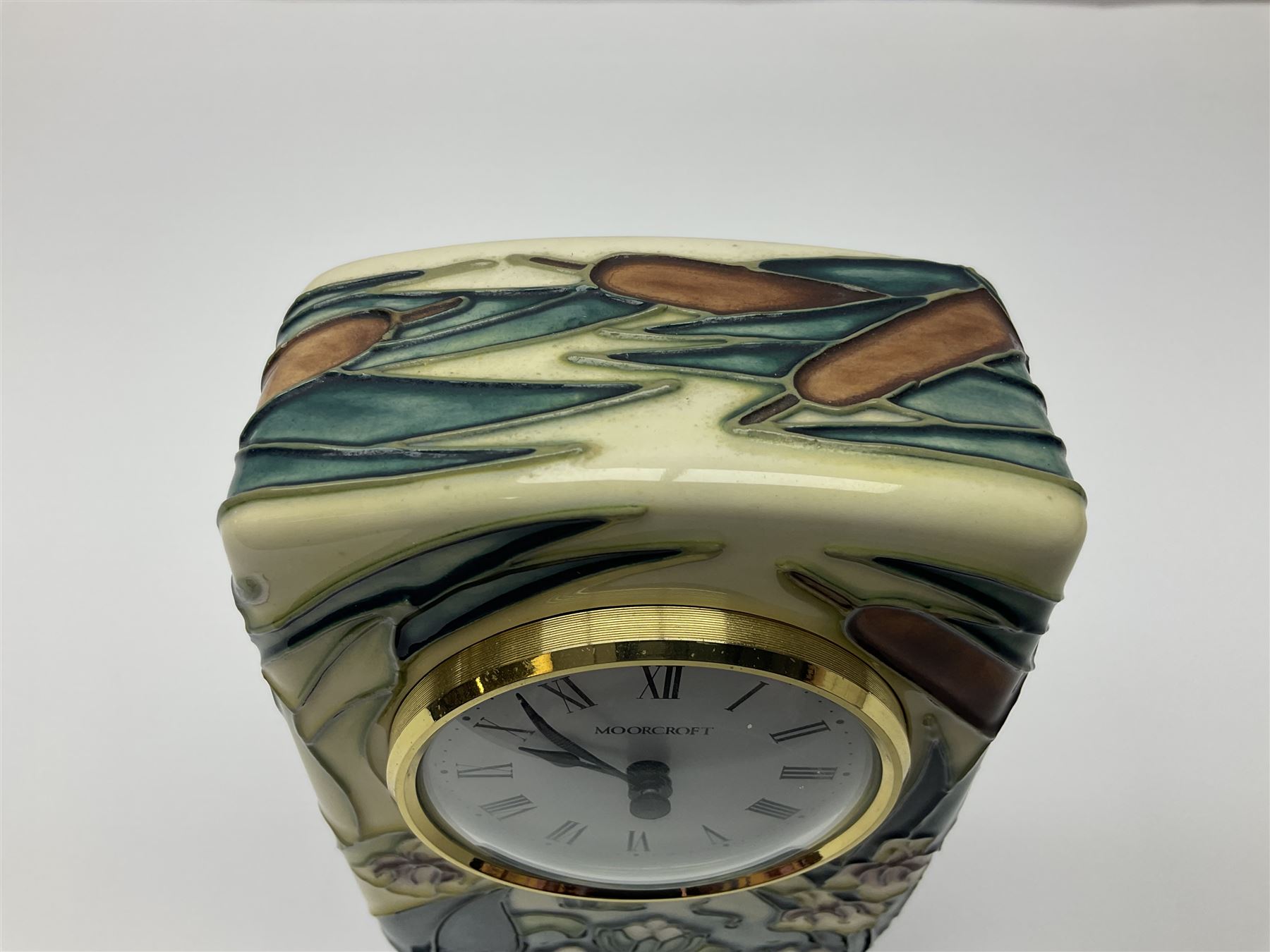 Moorcroft mantel clock, decorated in Bulrush and Water Lily pattern, with impressed and printed marks beneath, H15.5cm