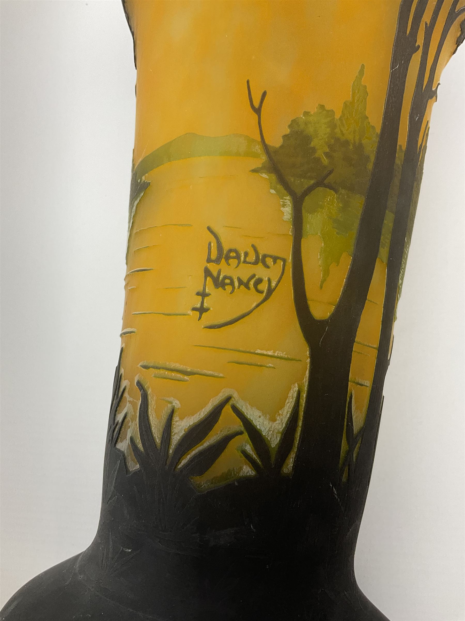 Reproduction Daum Nancy art nouveau style overlay and cut glass vase  decorated with woodland and a lake scene on a yellow ground, H35cm. 