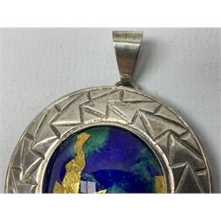 Silver pendant, with a green/green enamel centre with gold leaf detail