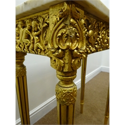  Gilt console table with rectangular marble top, decorated with cherubs and fruit swags, on fluted supports, W61cm, H76cm, D31cm  