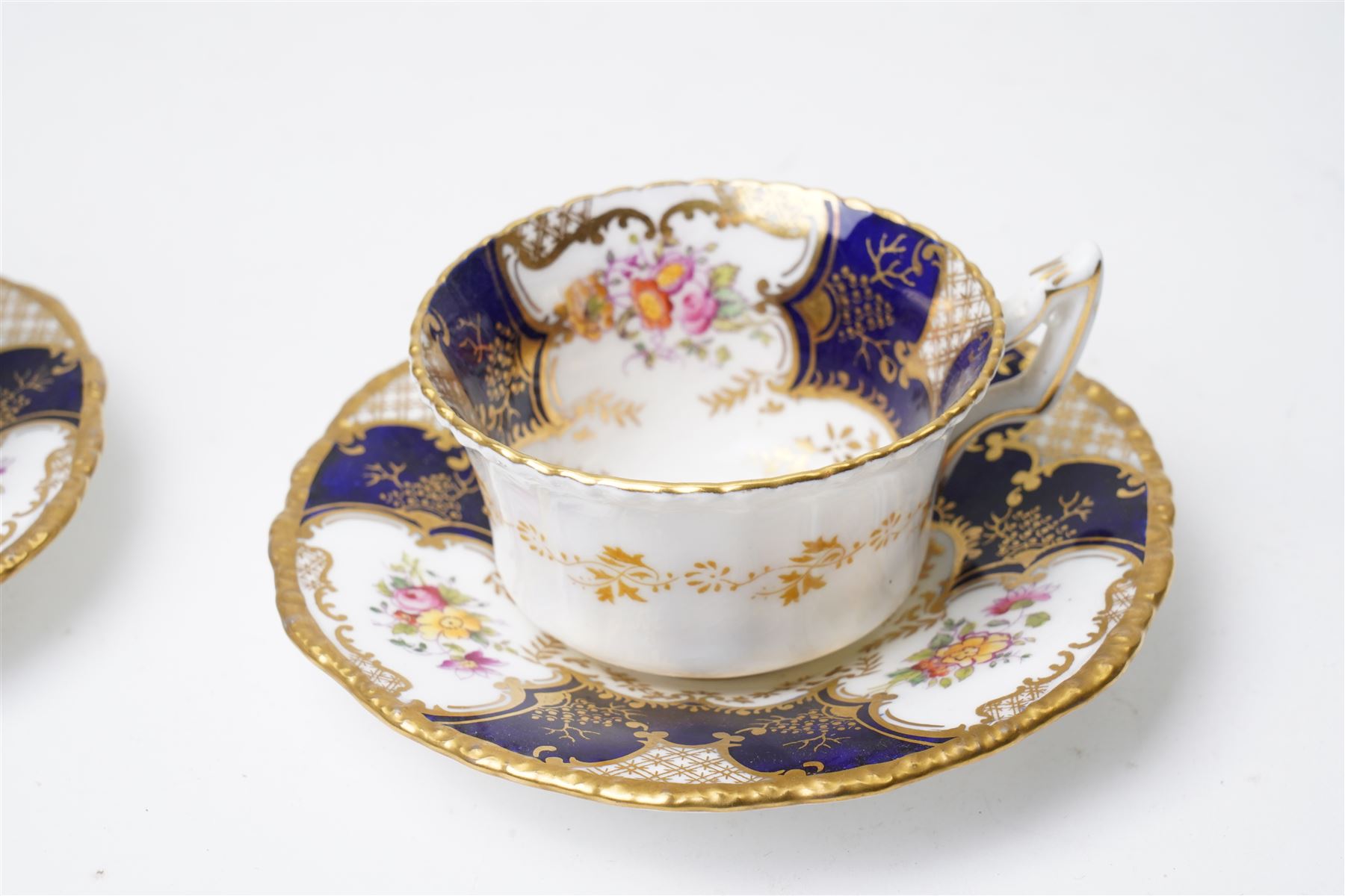 Grainger Lee & Co Worcester teacup, together with a collection of cobalt blue cabinet cups and saucers,  including a Royal Doulton hand-painted example by E Percy, and various others 19th century and later, mostly unmarked (7 pairs)