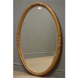  20th century mirror in gilt oval frame, bevelled glass plate, W68cm, H100cm  