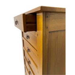 Light oak and cherry wood chest, fitted with seven drawers