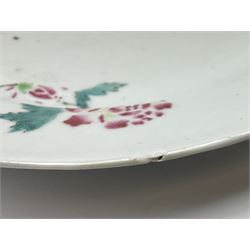 Three 18th century Chinese porcelain plates, each decorated with flowers upon a white ground, D22.5cm