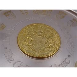 Modern limited edition silver The College of Arms plate to commemorate the The Queen's Silver Jubilee, the plain circular plate with central 24ct gold plated plaque depicting the Royal Arms, bordered by engravings of The College of Arms and the Kings Arms etc, by Danbury Mint, hallmarked Yorkshire Mint, Birmingham 1977, number 350/2500, in original fitted box with paperwork, D26,5cm, 