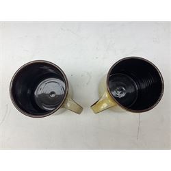 1960s Chelsea Pottery mug decorated with barrister by Joyce Morgan, signed JEM, together with a similar example depicting a doctor, H11.5cm, both signed beneath