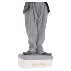 Two Spanish Algora Personajes Del Cine figures, modelled as Charlie Chaplin and Groucho Marx, with printed marks beneath, both with certificates of authenticity, H35cm