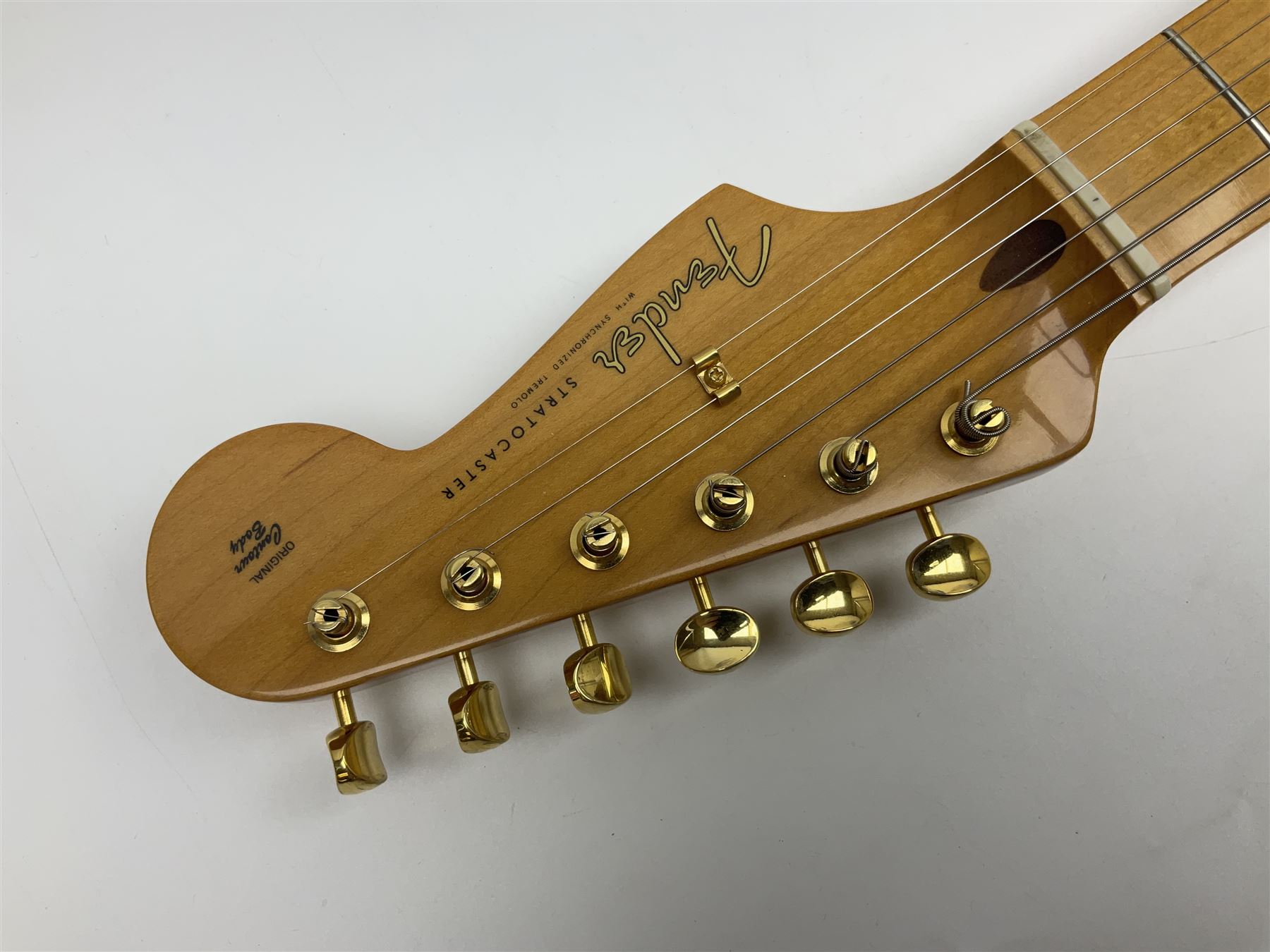 Fender Stratocaster 50th Anniversary 2004 metallic gold electric guitar; serial no.MZ4116369; L98cm; in Spider fitted case with owners manual and other paperwork, strap and belt buckle etc