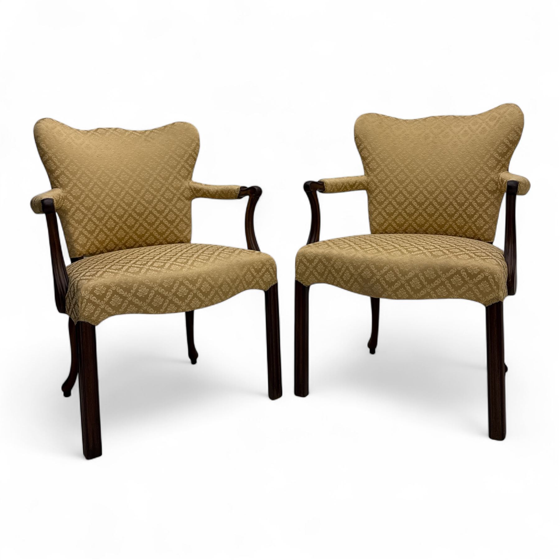 Pair of 19th century Hepplewhite style armchairs, shaped serpentine back over seat upholstered in gold damask fabric, with padded outswept arms and serpentine front rail, on moulded mahogany foreleg