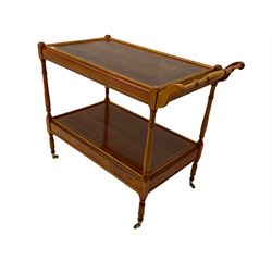 Yew wood drinks trolley, rectangular form with leather inset slide and turned handle, the undertier fitted with drawer, turned supports and brass castors