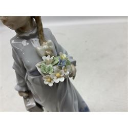 Three Lladro figures comprising, Pocket Full of Wishes no 7650, School Days no 7604 and Spring Bouquets no 7603, all with original boxes, largest example H26cm  