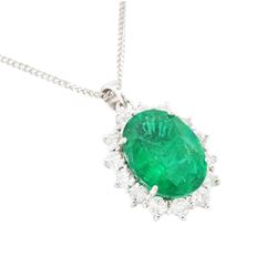 18ct white gold emerald and diamond pendant necklace, single oval cut  emerald of approx 3.25 carat, surrounded by fourteen round brilliant cut diamonds, on a fine link chain necklace, hallmarked, total diamond weight approx 0.50 carat