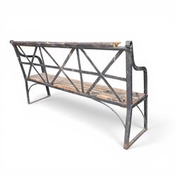 19th century and later Estate made wrought iron strapwork garden bench, the weathered wooden cresting rail over X-form strapwork back and slatted wooden seat
