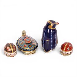 Four Royal Crown Derby paperweights, comprising Terrapin gold stopper, Rockhopper penguin gold stopper, Ladybird gold stopper and Beatle silver stopper