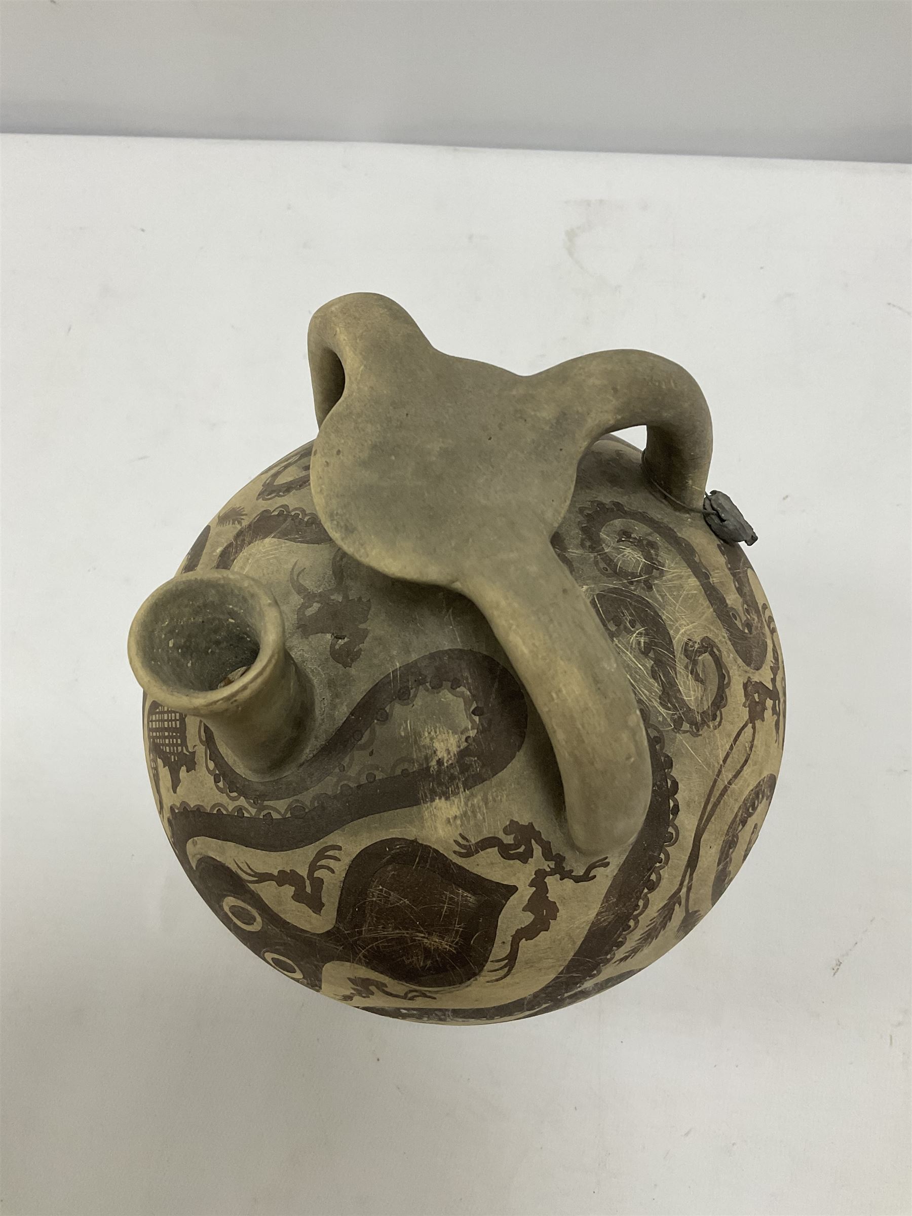 Reproduction Ancient Greek vessel in the style of Crete Minoan period, decorated with marine style ocotopi, with three handles and spout, signed beneath, H20cm
