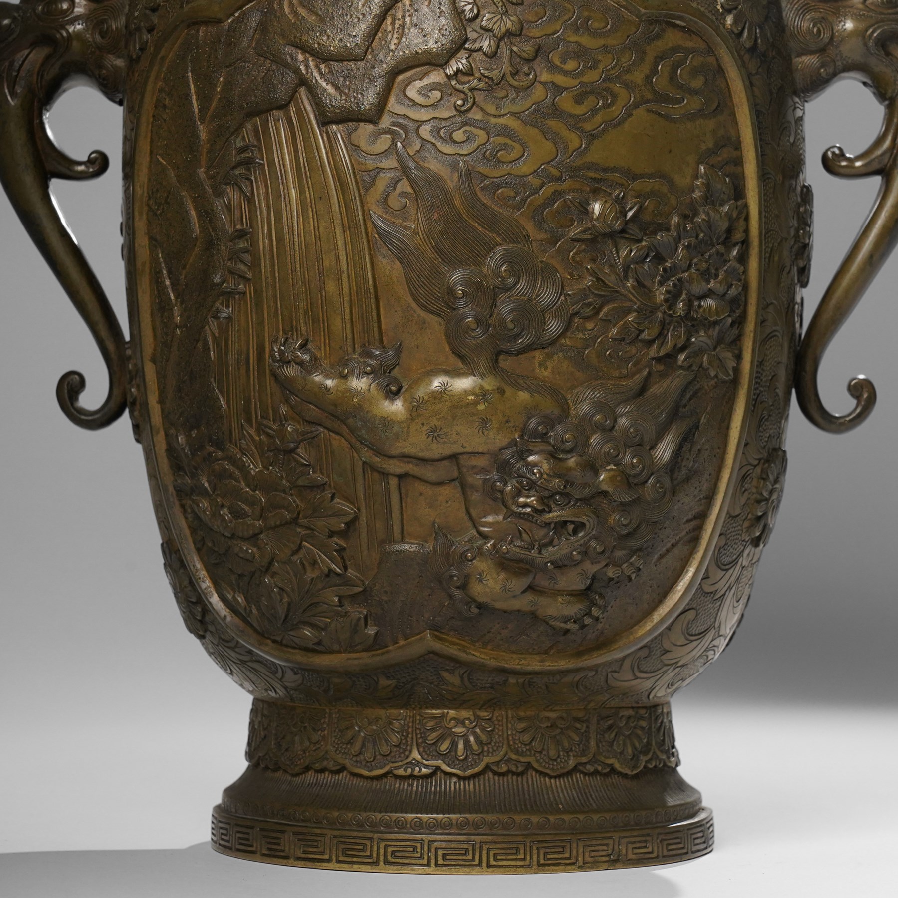 Japanese Meiji-Taisho period bronze vase, by Kanaya Gorosaburo, decorated with dragons and other creatures in a landscape, seal mark to base, H35.5cm 