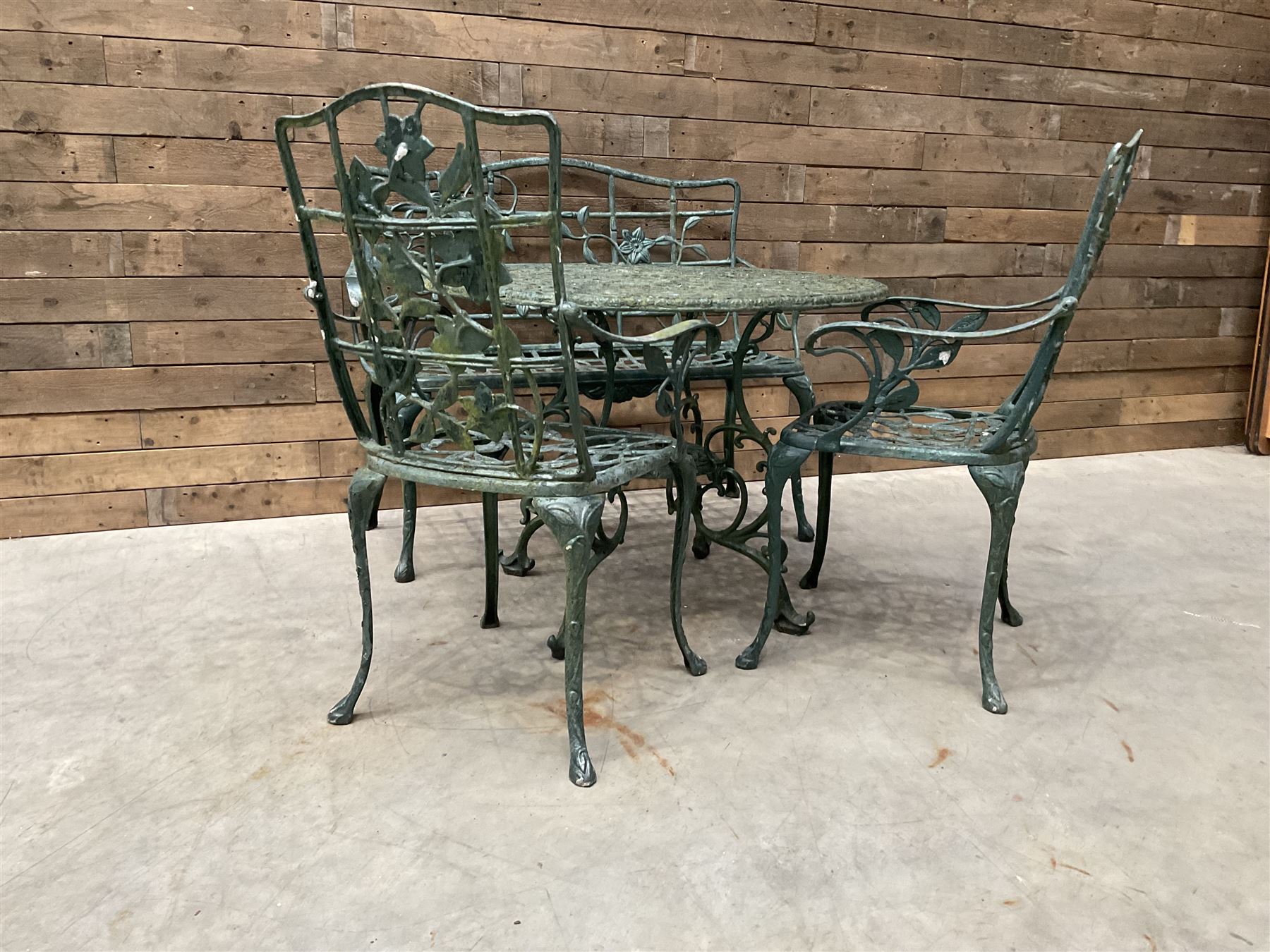 Cast aluminium garden dining set, comprising ornate circular table (D91cm, H68cm) a two seater bench, on cabriole supports (W118cm, H93cm, D55cm), and two matching armchairs (W55cm, H95cm, D54cm)