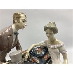 Lladro figure, Will You Marry Me, modelled as a courting couple on a garden bench, sculpted by Salvador Furió, with original box, no 5447, year issued 1987, year retired 1994, H27cm