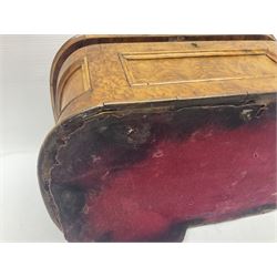 19th century figured walnut tea caddy, of rounded sarcophagus form, the hinged and slightly domed cover carved with monogramed panel flanked by acanthus leaves, opening to reveal a triple compartment interior with later mahogany lids, lifting to reveal remnants of zinc lining, H19cm L34cm D20cm