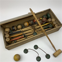 Table top wooden croquet set in the Victorian style with eight coloured mallets, eight corresponding balls, ten hoops and one wicket, in unmarked wooden box with sliding lid