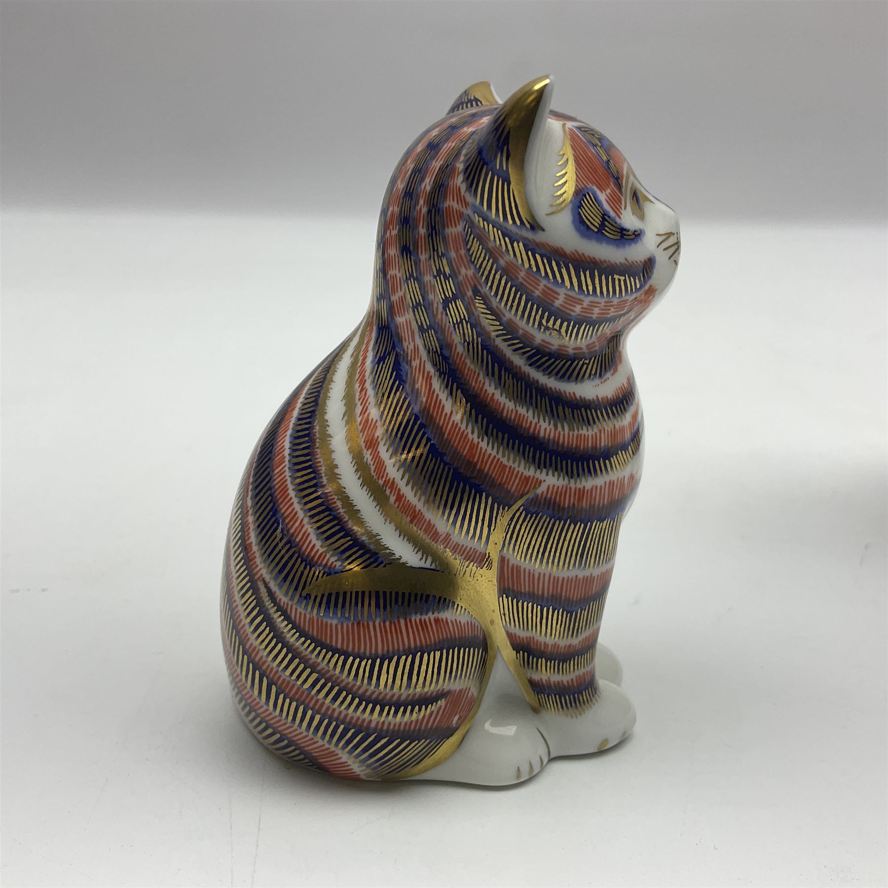 Three Royal Crown Derby paperweights, comprising of three cats, all with gold stoppers and printed mark beneath 