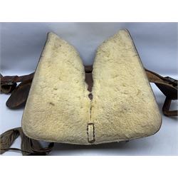 Western Saddle, with floral tooled leather decoration and sheep skin lined, complete with stirrups, L60cm 