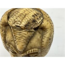 19th century carved ivory walking cane handle, modelled as the head of a greyhound with inset glass eyes, together with a further 19th century ivory example, modelled as a caricature of a gentleman's head, (2)