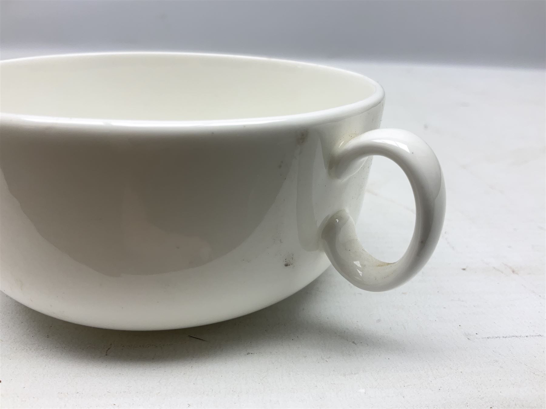 Thun WW2 German Luftwaffe officer's mess plain white glazed soup tureen with lion mask handles, marked with the Luftwaffe eagle beneath and dated 1939 L31cm; together with Waffen 'SS' white glazed twin handled soup bowl, marked beneath Bauscher Weiden 1942 (2)