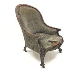 Victorian mahogany framed spoon back armchair, upholstered in a beige ground fabric, floral carved cabriole legs, W72cm