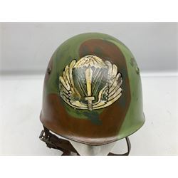 1960s Italian parachutist helmet with liner; camouflage paintwork with parachutist crest to the front