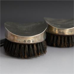Edwardian tortoiseshell page turner with silver handle, hallmarked Birmingham 1906, maker's mark worn and indistinct, together with a pair of Edwardian silver mounted horsehair brushes engraved with monogram, and two faceted glass jars with silver lids and applied initial N to covers, all hallmarked 