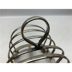 Silver plate seven bar toast rack, of curved form with central ring handle, upon bun feet, H13cm 