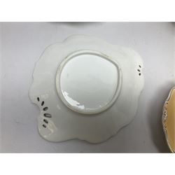 Victorian part dessert service, including eighteen plates, four small serving dishes, shallow dish, etc hand painted with floral sprigs within a cream border with floral panels, and heightened in gilt (26cm)