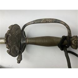 19th century continental courtsword, with plain 77.5cm double-edged steel blade, silvered brass hilt with knucklebow and ornate shell guard with central crowned crest stamped on reverse P.T.A.; in metal mounted leather scabbard L93cm overall; and another continental courtsword with double fullered blade and brass hinged shell guard applied with a medical badge; lacking scabbard (2)