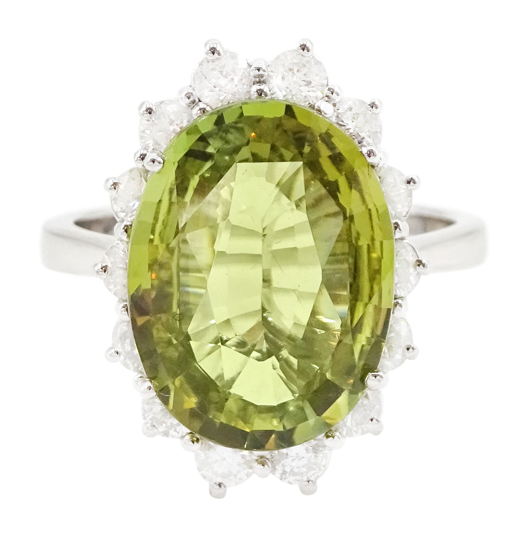 18ct white gold alexandrite and diamond cluster ring, the natural oval cut green alexandrite of approx 5.95 carat, surrounded by fourteen round brilliant cut diamonds, stamped 750, total diamond weight approx 0.80 carat