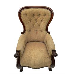 Victorian mahogany upholstered armchair, moulded framed, scroll carved arm terminals on scrolled cabriole supports, shaped carved apron