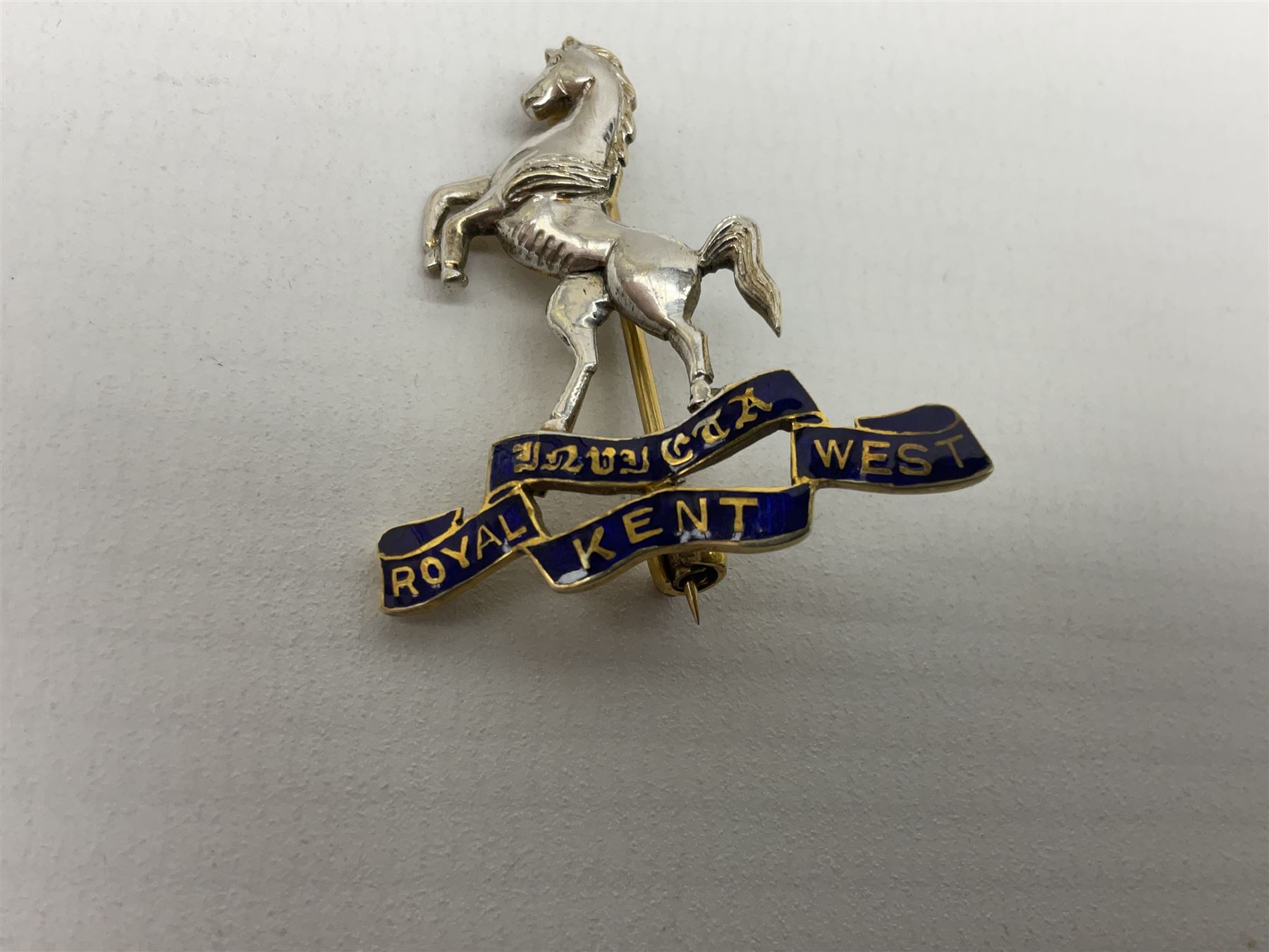 Royal West Kent regiment 9ct gold and enamel sweetheart brooch; The Queens Own regiment silver and enamel sweetheart brooch; and another sweetheart brooch for the Royal West Kent regiment (3)