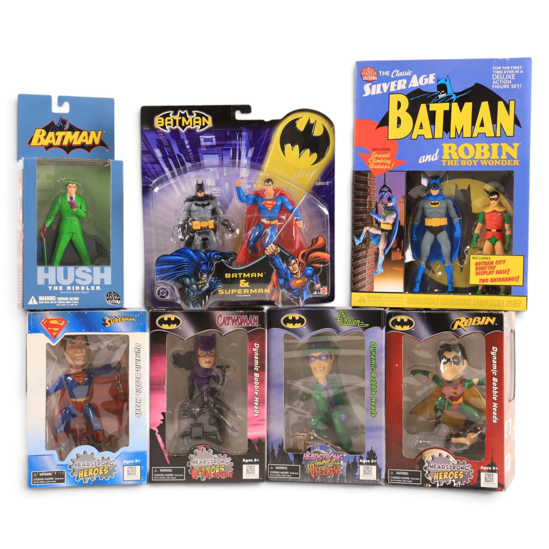 Four Monogram Headstrong Heroes bobble heads, comprising Superman, The Riddler, Catwoman and Robin, together with a DC Direct Deluxe Action Figure Set, DC DIrect Hush The Riddler figure and a Mattel Batman & Superman figure pack, all boxed